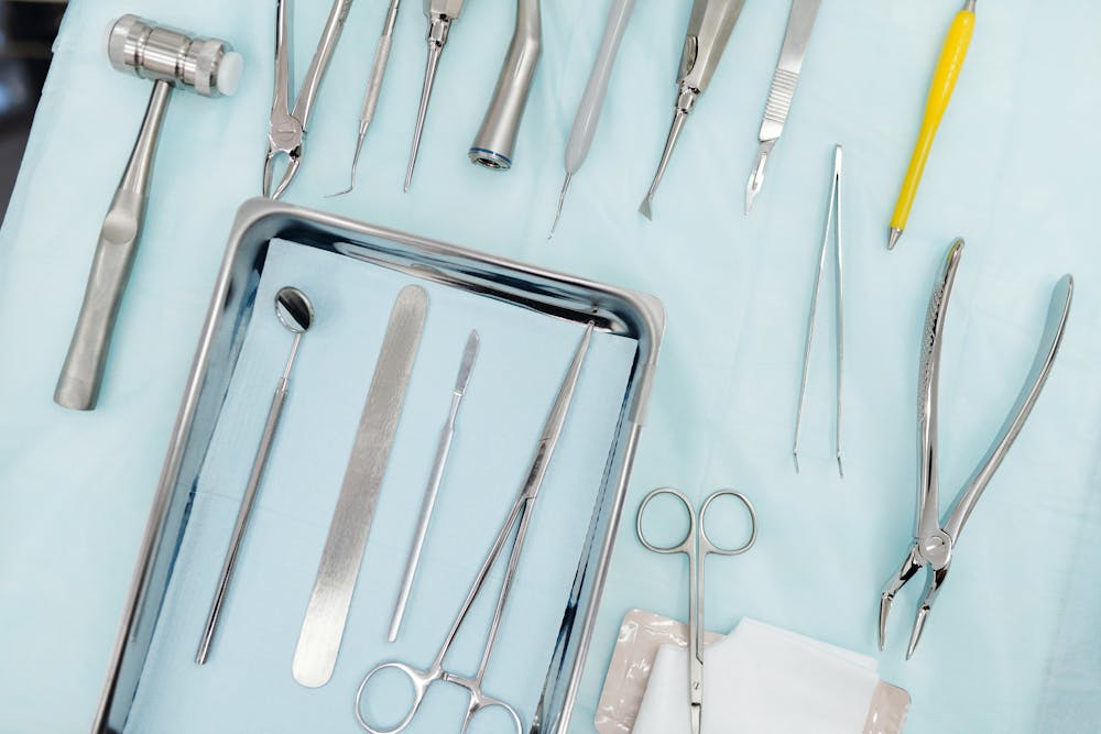 Stainless Steel Dental Tools on the White Surface