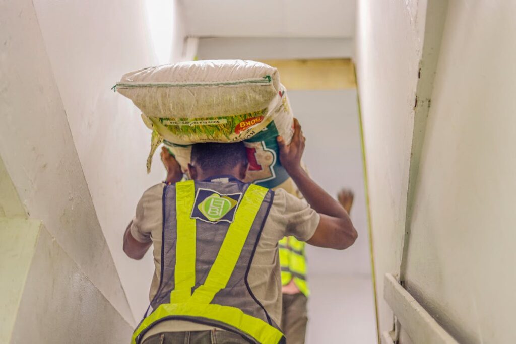 A worker carrying a bag