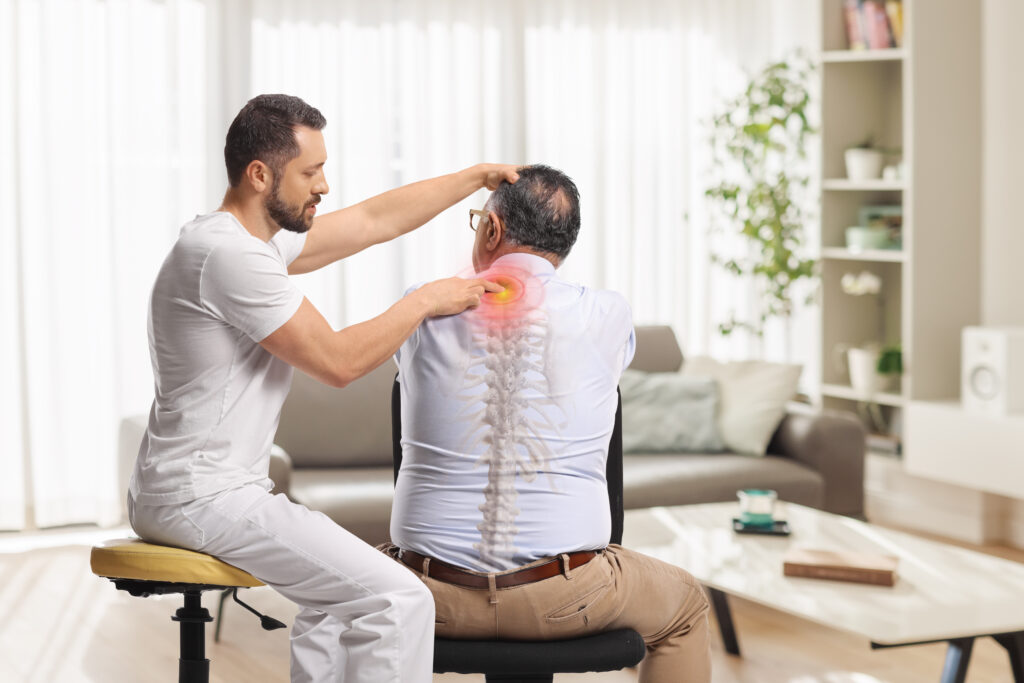 Physical therapist giving a massage to a man