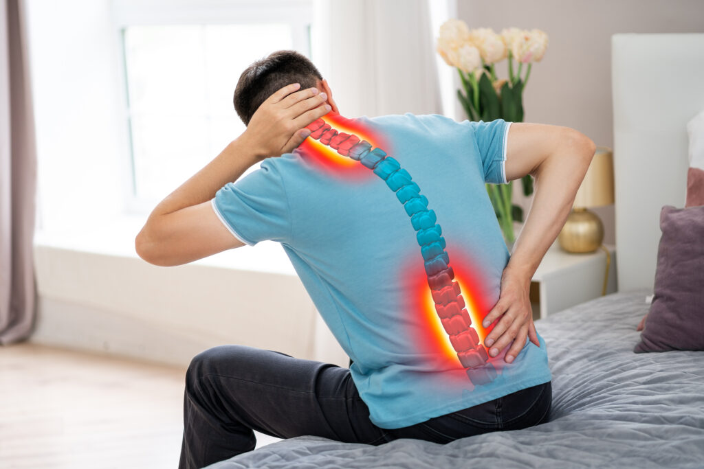 Lumbar and cervical spine hernia, man with back pain at home, compression injury of the intervertebral disc, photo with highlighted skeleton